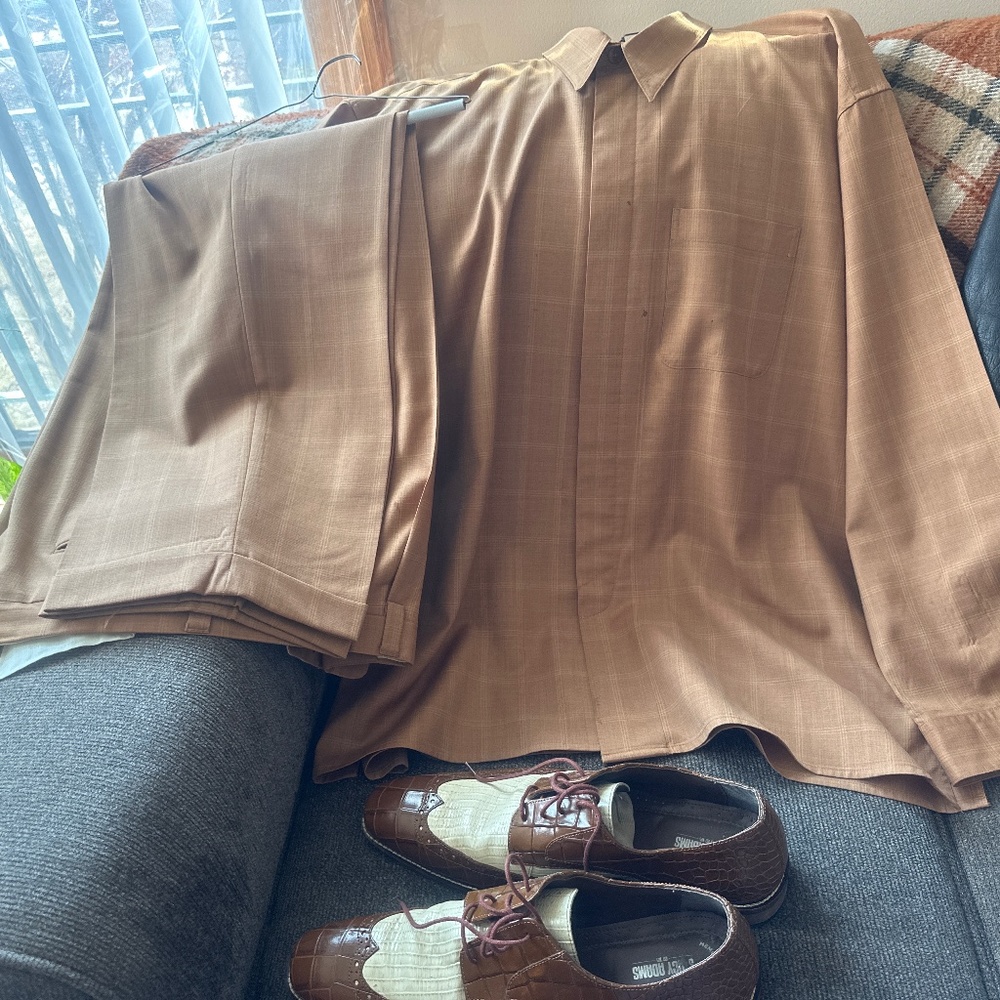 A black 3 quarter leather jacket, two peace outfit and shoes to match.